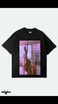 a black t - shirt with a photo of a woman in a bathing suit